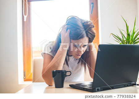 Tired businesswoman sleeping on table in office. Young exhausted girl working from home. Tired businesswoman sleeping on table in office. Young exhausted girl working from home. 77938824