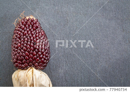 stone background with strawberry corn stone background with strawberry corn 77940734