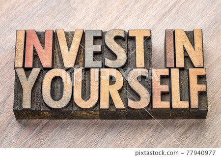 invest in yourself word abstract in wood type 77940977