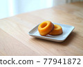Sugar donuts on a plate 77941872