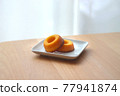 Sugar donuts on a plate 77941874