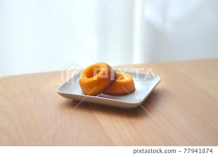 Sugar donuts on a plate 77941874