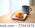 Sugar donuts and mug on a plate 77941878