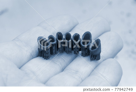 Tooth dental crowns created on 3d printer for metal Tooth dental crowns created on 3d printer for metal 77942749
