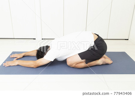 A man stretching A man stretching 77943406