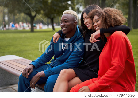 Multi-ethnic group people teenage friends. African-american, asian, student spending time together Multiracial friendship Multi-ethnic group people teenage friends. African-american, asian, student spending time together Multiracial friendship 77944550