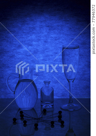 Still life with glass objects on a blue background 77946372