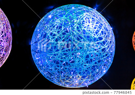 Abstract neon futuristic magic glowing art LED background with wicker shapes multicolored blue, red pink purple yellow orange balls with plastic fiber texture in black space Abstract neon futuristic magic glowing art LED background with wicker shapes multicolored blue, red pink purple yellow orange balls with plastic fiber texture in black space 77946845