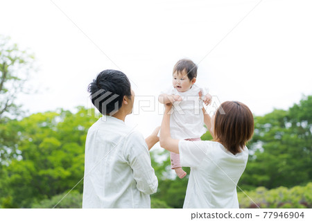 Hug family baby green background 77946904