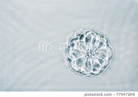 Cosmetic moisturizer micellar water. Abstract flower made from splash of liquid. Soft focus 77947809