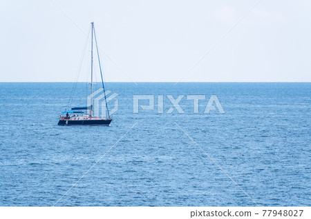Sailing yacht in the blue calm sea. 77948027