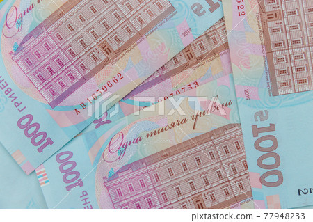 Ukrainian currency. Background of one thousand hryvnia banknotes Ukrainian currency. Background of one thousand hryvnia banknotes 77948233