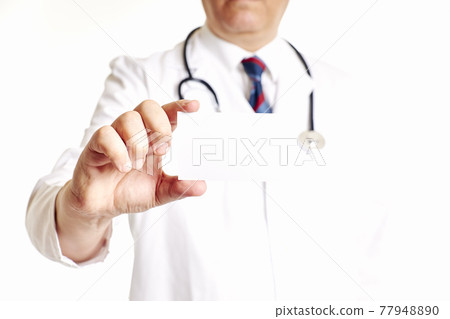 Doctor with a stethoscope holding a blank card. Health, care concept 77948890
