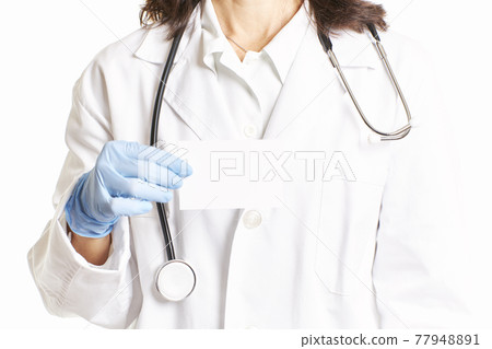 Female doctor with blue latex gloves holding a card. Health concept Female doctor with blue latex gloves holding a card. Health concept 77948891