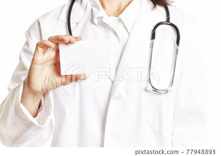 Female doctor with a stethoscope holding a blank card. Health concept Female doctor with a stethoscope holding a blank card. Health concept 77948893