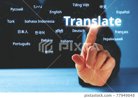 Person abstractly presses on the display with the word translate and foreign languages 77949848