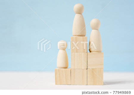 Figure of men on cubes are located as prize places on blue background. Figure of men on cubes are located as prize places on blue background. 77949869