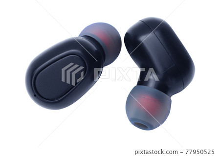 Small wireless headphones isolated on white background. Small wireless headphones isolated on white background. 77950525