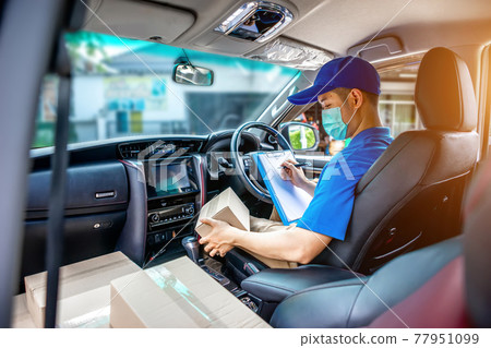 Asian deliveryman staff are preparing packages to deliver to customers who order online during the coronavirus or covid-19 outbreak. Asian deliveryman staff are preparing packages to deliver to customers who order online during the coronavirus or covid-19 outbreak. 77951099