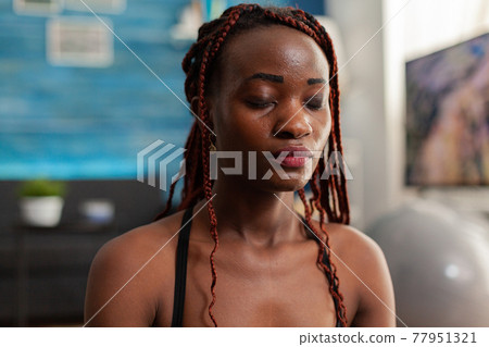 Black woman training body and mind meditating Black woman training body and mind meditating 77951321