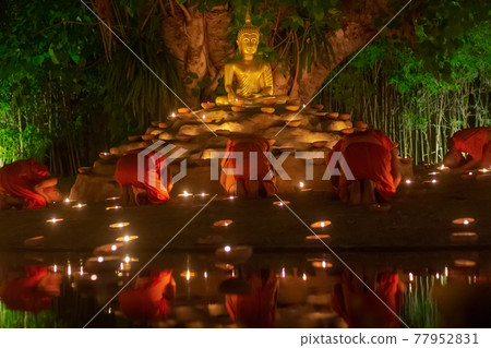 Visakha Puja Day (Vesak). Buddhist monk fire candles and pray to the Buddha in Chiang Mai Thailand. Visakha Puja Day (Vesak). Buddhist monk fire candles and pray to the Buddha in Chiang Mai Thailand. 77952831