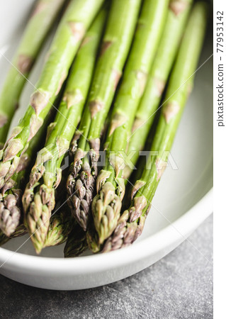 Asparagus in white ceramic baking dish. Asparagus in white ceramic baking dish. 77953142