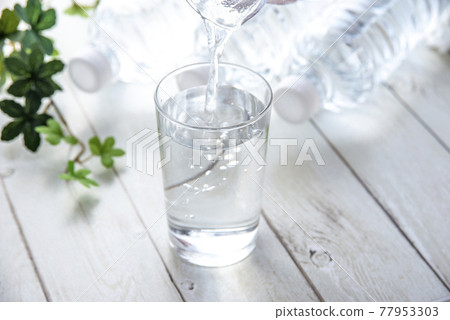 PET bottles and cups placed on the table PET bottles and cups placed on the table 77953303