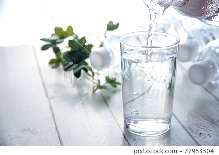 PET bottles and cups placed on the table 77953304