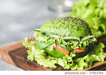 Avocado burger with salmon. Avocado burger with salmon. 77953764