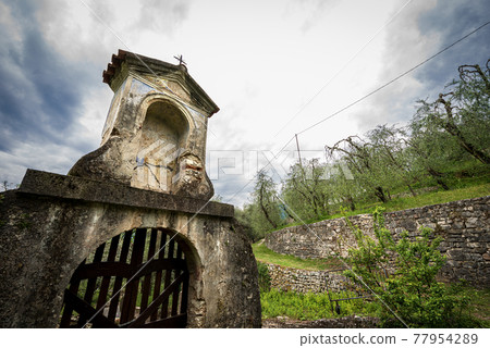 Small and Ancient Votive Shrine on the Coast of Lake Garda - Veneto Italy Small and Ancient Votive Shrine on the Coast of Lake Garda - Veneto Italy 77954289