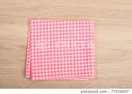 Red table napkins isolated on white background . 77956607