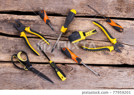 Repair tools on old wooden background. 77959201
