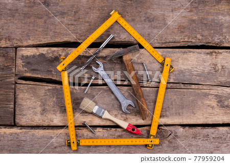 Different construction tools for construction on rustic background. 77959204