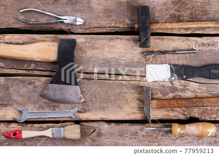 Set of construction tools on old wooden background. Set of construction tools on old wooden background. 77959213