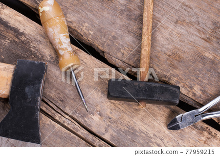 Different tools on old wooden background. Different tools on old wooden background. 77959215