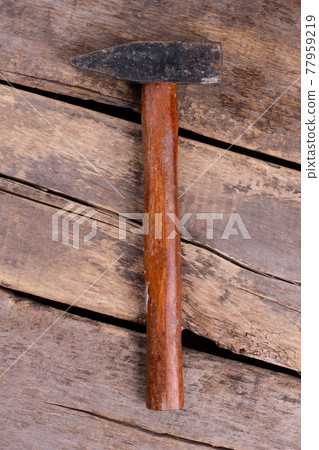Top view of hammer with wooden handle. Top view of hammer with wooden handle. 77959219