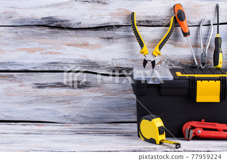Repair tools on wooden background. Repair tools on wooden background. 77959224
