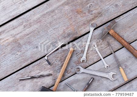 Different construction tools on wooden background. 77959487