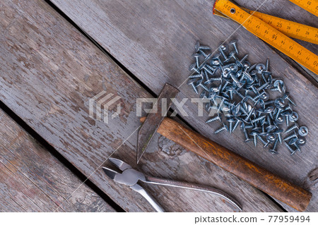 Set of carpenters tools on wooden background. 77959494