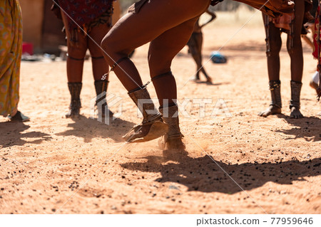 Himba women dancing at their village Himba women dancing at their village 77959646