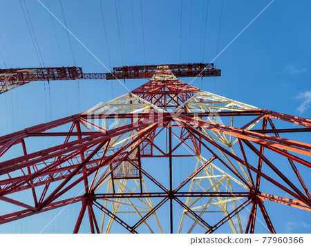 high voltage post. High-voltage tower sky background. high voltage post. High-voltage tower sky background. 77960366