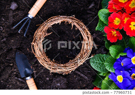 Gardening tools and flowers on the garden terrace. Gardening tools and flowers on the garden terrace. 77960731
