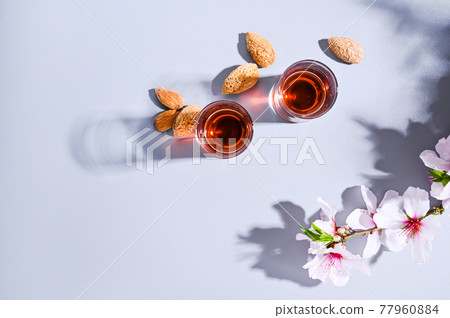 almond liquor traditional strong drink in italy  77960884