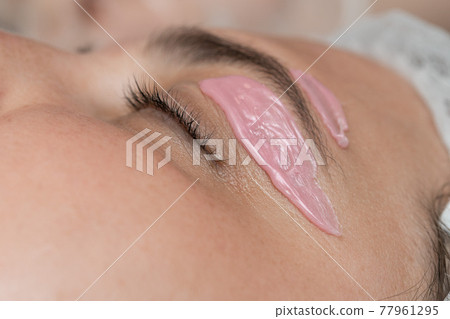 Hand of cosmetologist applying wax paste on armpit. Hand of cosmetologist applying wax paste on armpit. 77961295