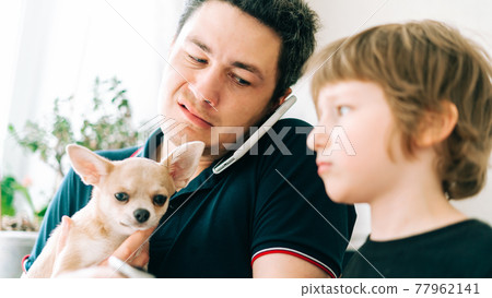 Father working from home online with dog. Stressed with son 77962141