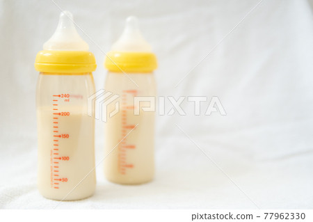 Baby bottle with milk 77962330