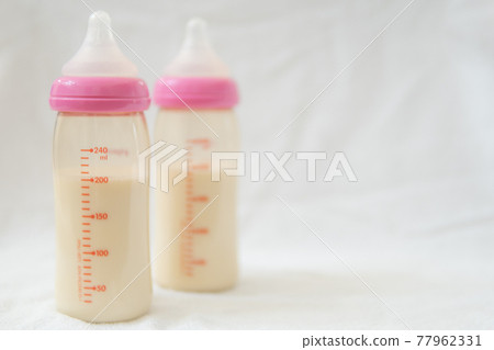 Baby bottle with milk Baby bottle with milk 77962331