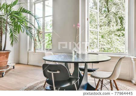 Round table with chairs near window Round table with chairs near window 77964445