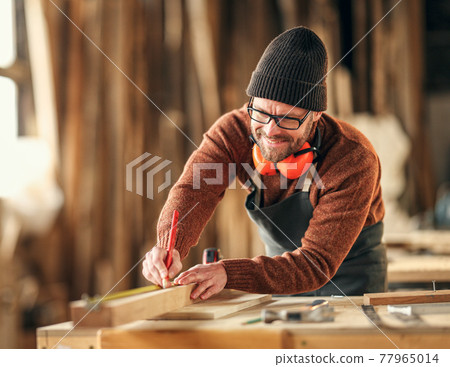 Joiner making marks on wooden detail Joiner making marks on wooden detail 77965014