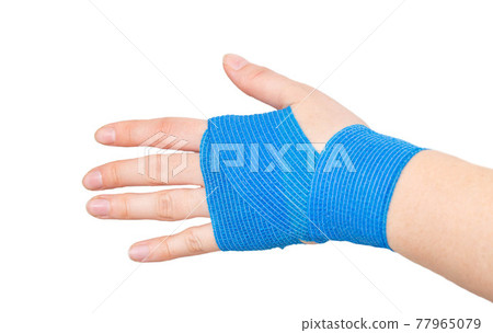 Blue elastic bandage on the wrist on a white background, isolate. Concept for fixation of the wrist joint for sports and avoidance of injuries, close-up Blue elastic bandage on the wrist on a white background, isolate. Concept for fixation of the wrist joint for sports and avoidance of injuries, close-up 77965079